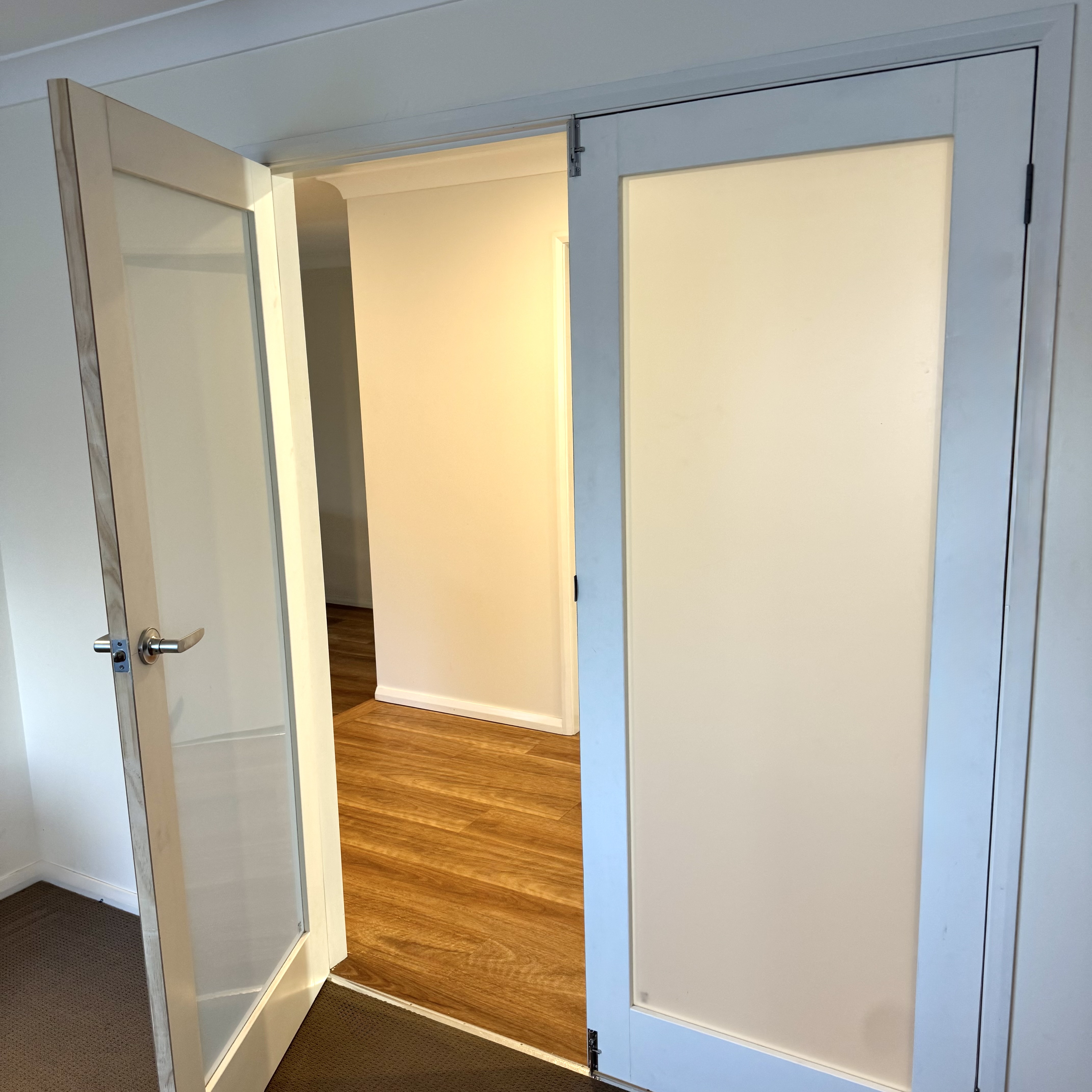 Glass-panel French doors installed by TW Fixouts
