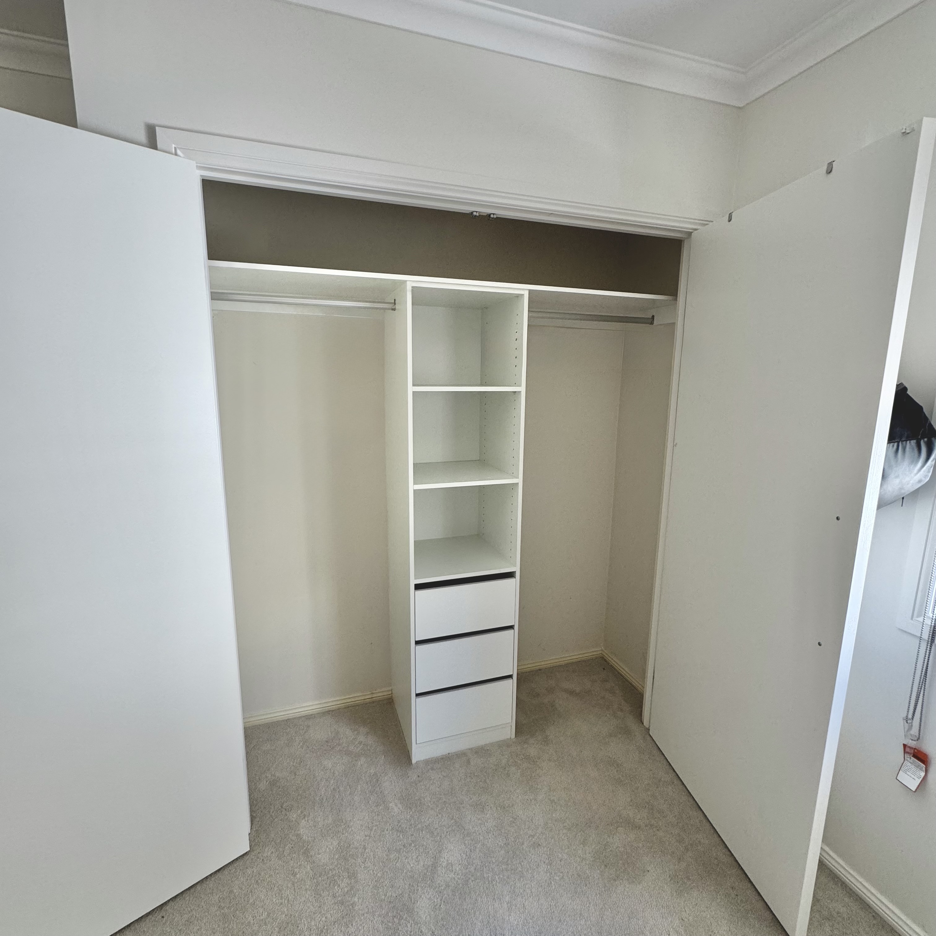 Built-in wardrobe by TW Fixouts — Shelving · Drawers · Hanging space